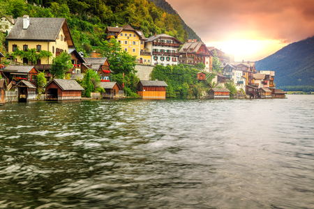 Stunning alpine village with wooden boathouse and magical sunrise,Hallstatt,Salzkammergut,Austria,Europeの写真素材