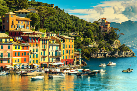 Traditional colorful mediterranean houses with yachts and fishing boats in luxury harbor, Portofino, Liguria, Italy, Europeのeditorial素材