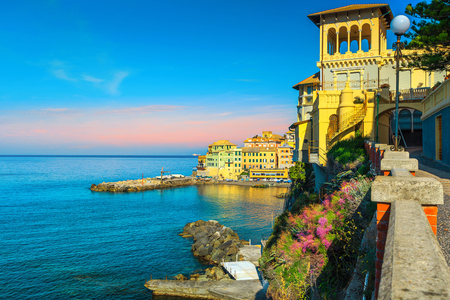 Amazing mediterranean beach destination. Beautiful promenade and colorful retro buildings with colorful flowers near Genoa, Bogliasco, Liguria, Italy, Europeの写真素材