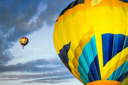 Fantastic multicolored hot air balloons on the sky at sunsetの写真素材