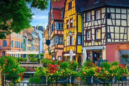 Popular touristic place and travel location. Picturesque street view with colorful buildings and flowers, Colmar, France, Europeの写真素材