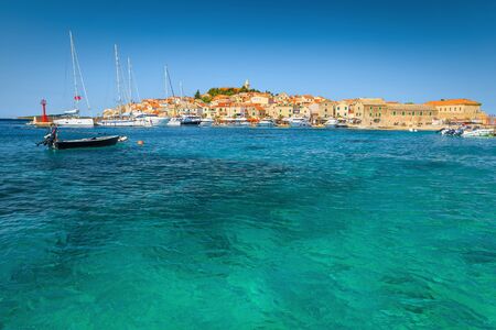 Well known Adriatic touristic destination. Admirable mediterranean old fishing village with stone houses and picturesque harbor, Primosten, Dalmatia, Croatia, Europeの写真素材