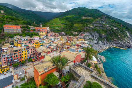 Vernazza resort panorama view from the tower of Doria castle. Colorful mediterranean houses, gardens...