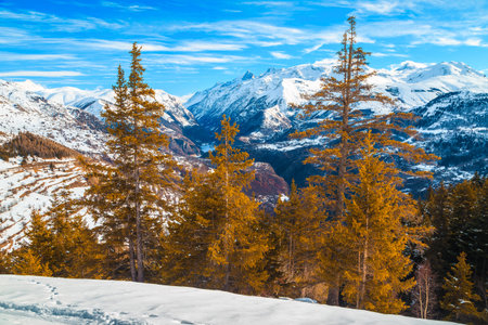 Wonderful sunny winter scenery and snowy mountains in Alpe d Huez fantastic ski resort, France,...
