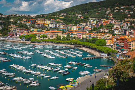 Stunning mediterranean beach resort view from the hill with harbor and seaside colorful buildings, Lerici, Liguria, Italy, Europeの写真素材