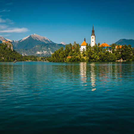 Great excursion place and boat tours on the lake Bled. Old church on the small island and famous castle on the cliff, Bled, Slovenia, Europeの写真素材