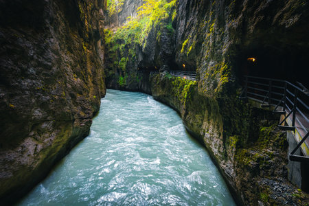 Tourist footbridge with tunnels in the Aare gorge. Great scenery with mountain river in the deep gorge, Meiringen, Switzerland, Europeの写真素材