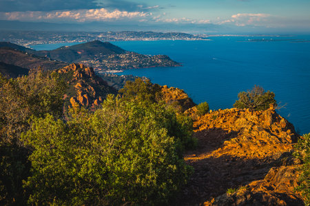 Great hiking destinatio near Cannes, Pic du Cap Roux peak. Picturesque red rocks and blue sea view from the peak, Esterel massif, near Saint-Raphael, Frejus, France, Europeの写真素材