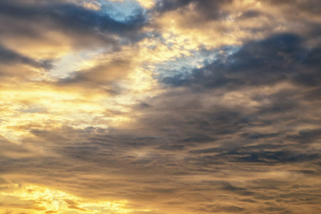 Overcast sky with dark clouds and orange light