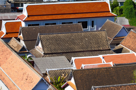 view over the roofs covered with tiles in the thai templeの写真素材