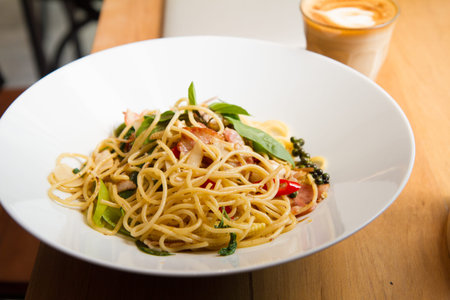 spaghetti spicy with bacon, parsley and parmesan cheese Fresh pepper, Basil leaf . Pasta Carbonara...