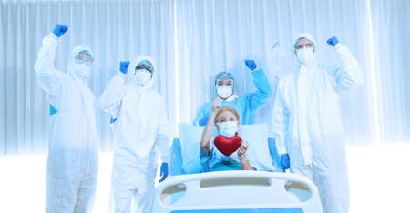 doctor and disease control experts team can handle patients , virus patient has recovered. prevention, immunization keep vital organ systems functioning and treatment from virusの写真素材