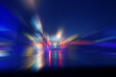Blurred car light reflexion on road wet in the night city. speed light automobile