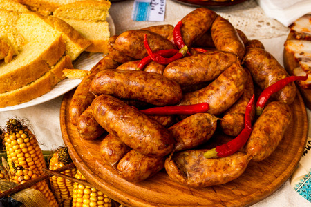 Village Bobovische (Mukachevo district, Zakarpatska region, Ukraine.) - 2016 October 16: Traditional sausages and chili pepper on the counter during etnofestival "Bobovischanske Grono 2016". Etnofestival visitors can review with the local traditions of wiのeditorial素材