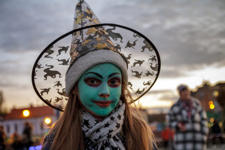 Uzhgorod, Ukraine - October 31, 2016: Participant of Funny Halloween celebration in the image of the witch is walking in the city center.のeditorial素材