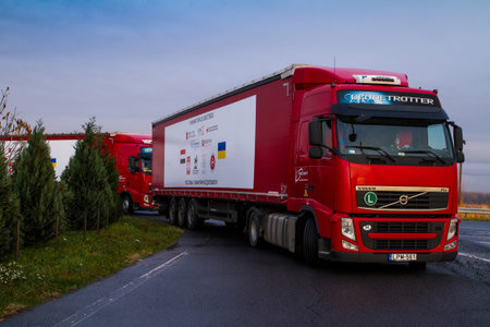 Chop, Ukraine - November 9, 2016: Trucks loaded with humanitarian aid from Hungary stand in a parking lot near the international checkpoint. Religious Communities of Hungary was sent to Ukraine of 50 tons of humanitarian aid.のeditorial素材
