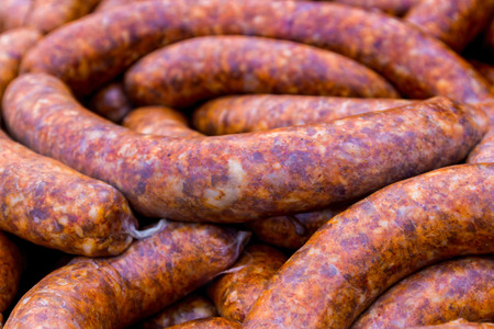 Hecha, Ukraine - February 11, 2017: Fresh peppered pork sausage on the counter of one of the participants of the international gastronomic festival of butchers. Festival visitors had the opportunity to taste Hungarian and Transcarpathian dishes of pork, cのeditorial素材