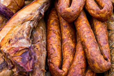 Hecha, Ukraine - February 11, 2017: Fresh peppered pork sausage and bacon on the counter of one of the participants of the international gastronomic festival of butchers. Festival visitors had the opportunity to taste Hungarian and Transcarpathian dishes のeditorial素材
