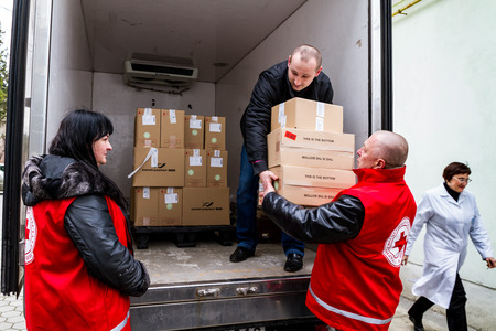 Uzhhorod, Ukraine - March 16, 2017: Employees of the Red Cross Society unload boxes of measles vaccines that entered the Transcarpathian region within the framework of humanitarian aid from Hungary.のeditorial素材