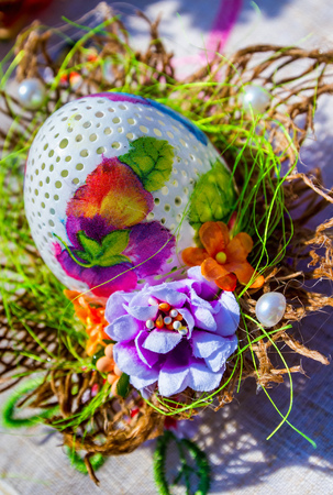 Uzhhorod, Ukraine - March 31, 2017: Pysanka (Ukrainian Easter egg) made by the technique of decoupage and carving on the eggshell at the Easter ethno-fair in Uzhhorod.のeditorial素材