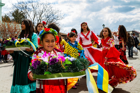 Uzhhorod, Ukraine - April 7, 2017: Participants in the celebration of the International Roma Day perform Romany folk dances in the city center.のeditorial素材