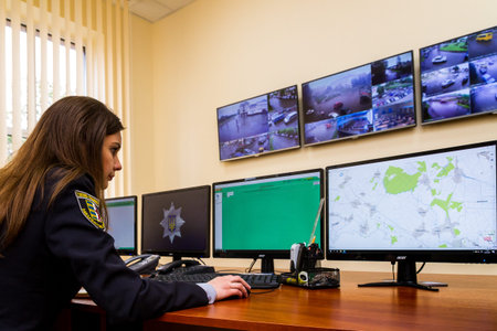 Uzhgorod, Ukraine - May 5, 2017: Police woman processes real-time data during the opening of the...