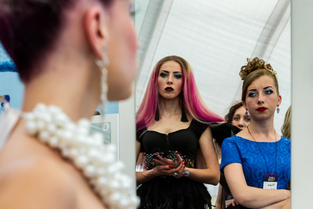 Uzhhorod, Ukraine - May 19, 2017: Displaying spectators in the mirror during the International Beauty Industry Competition Royal Beauty Carpathian Cup 2017.のeditorial素材