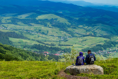 Pylypets, Ukraine - June 25, 2017: Tourists resting after climbing on a mountain top Hymba in the Carpathian mountains near the village Pylypets.のeditorial素材