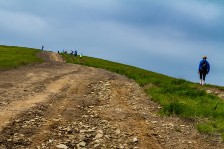 Pylypets, Ukraine - June 25, 2017: Hikers climb the peak of the Mount Hymba in the Carpathians near the village of Pylypets.のeditorial素材
