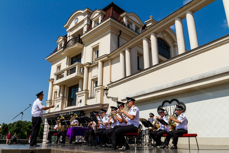 Uzhgorod, Ukraine - June 28, 2017: Musicians of the police brass band perform during a concert on the Day of the Constitution of Ukraine in the city center.のeditorial素材