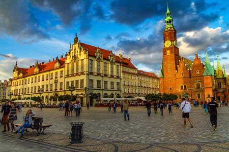 Wroclaw, Silesia, Poland - July 25, 2017: People walk on the market square in the historic part of the city in beautiful evening light.のeditorial素材