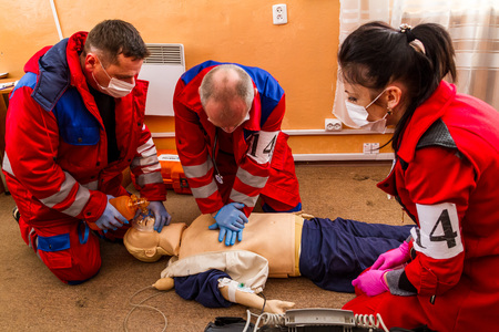 Uzhhorod, Ukraine - November 16, 2017: The paramedics brigade performs artificial respiration on a dummy during the competition.のeditorial素材