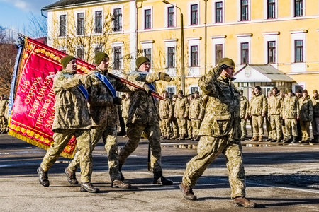Uzhgorod, Ukraine - January 30, 2018: Honor guard carries the flag of the 128th separate mountain...