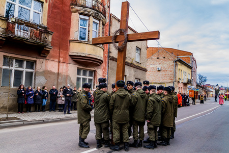 Uzhgorod, Ukraine - March 11, 2018: Ukrainian soldiers hold Cross during the cross march marking the Veneration of the Cross Sunday in Uzhgorod.のeditorial素材
