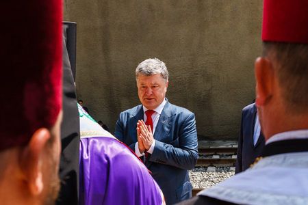 Skotarske, Ukraine - May 24, 2018: President of Ukraine Petro Poroshenko (C) talks with priests during the opening of the new Beskydy railway tunnel in the Carpathians.のeditorial素材