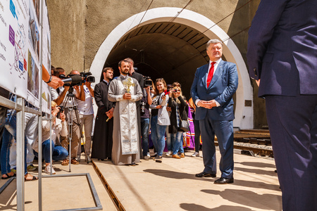 Skotarske, Ukraine - May 24, 2018: Ukrainian President Petro Poroshenko (R2) speaks at the opening of a new Beskydy railway tunnel in the Carpathians.のeditorial素材