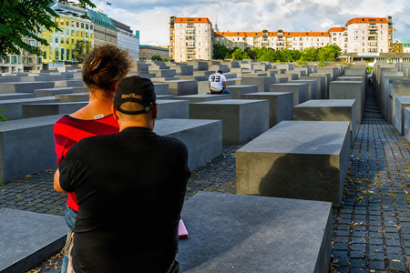 Berlin, Germany - July 27, 2017: Tourists view the memorial to the murdered Jews of Europe, also known as the Holocaust Memorial.のeditorial素材