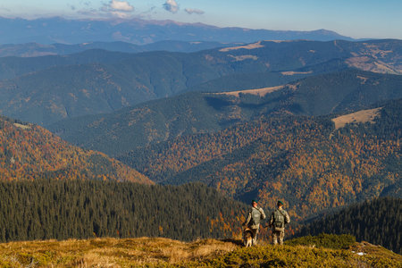 Dilove, Ukraine - October 10, 2018: Ukrainian border guards with a dog patrol the Ukrainian-Romanian border in the Carpathian Mountains.のeditorial素材