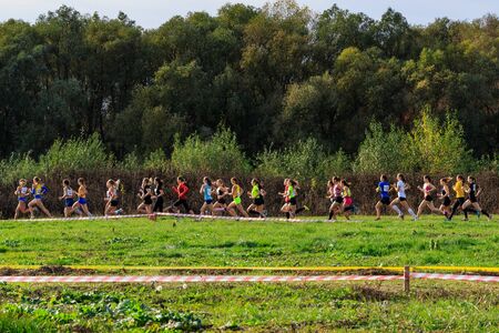 Athletics - Ukrainian Cross Country Championships - Ukraine, Uzhgorod, October 30, 2019: Group of young female athletes in action during the Ukrainian Cross Country Championship.のeditorial素材