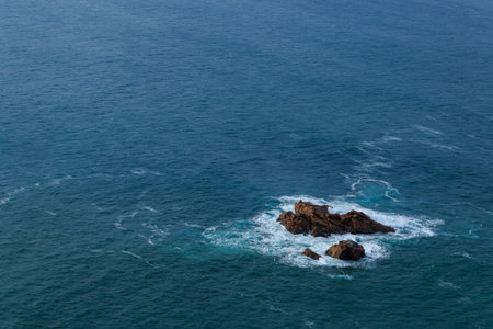Coastal cliffs in the Atlantic Ocean at Cape Roca (Cabo da Roca) in Portugal.