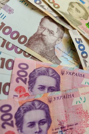 Ukrainian hryvnia, several banknotes of 1000, 500 and 200 hryvnias. Financial background from Ukrainian banknotes.  Close-up.の写真素材