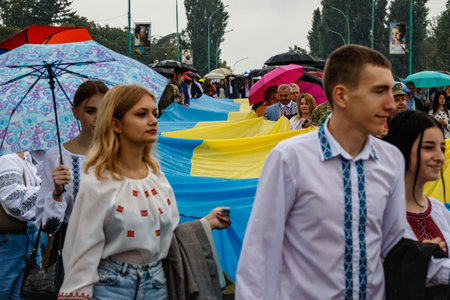 Uzhgorod, Ukraine - August 24, 2021: Local residents carry a 100-meter flag during a solemn procession on the occasion of the Independence Day of Ukraine.のeditorial素材