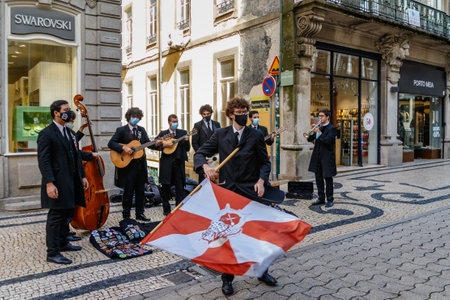 Porto, Portugal - September 11, 2021: Street musicians in medical masks perform on a central street in Porto, Portugal.のeditorial素材