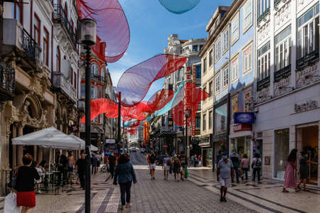 Porto, Portugal - September 11, 2021: Tourists stroll along the main, mostly pedestrianized shopping street Santa Catarina in Porto, Portugal.のeditorial素材