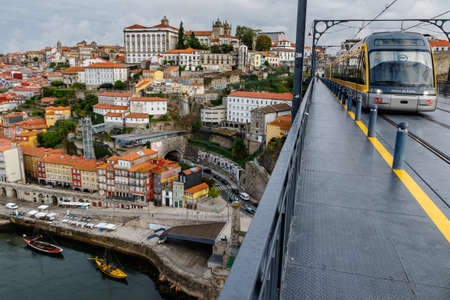 Porto, Portugal - September 11, 2021: View of Ribeira historical quarter on the margin Douro river embankment in the old town and Luis I bridge, Porto, Portugal.のeditorial素材