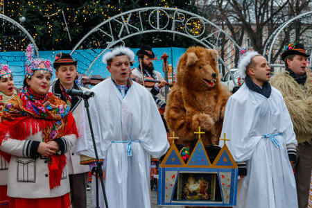 Uzhhorod, Ukraine - December 27, 2021: People in traditional Hutsul costumes sing Christmas carols...