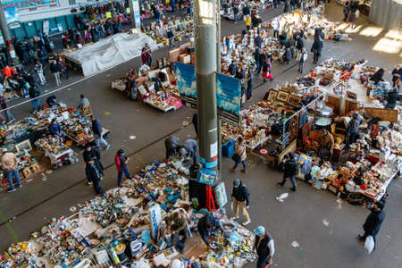 Barcelona (Catalonia, Spain) - January 8, 2022: Unidentified people choose a product among the stalls of Barcelona's most famous flea market, located in the Glories district.のeditorial素材