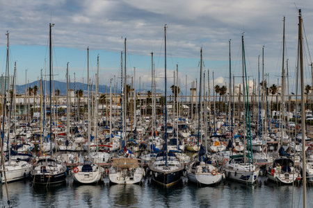 Barcelona (Catalonia, Spain) - January 5, 2022: View of the moored yachts in Port Vell harbor in the...