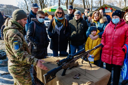 Uzhhorod, Ukraine - February 13, 2022: A military instructor introduces civilians to a Z-10 carbine...