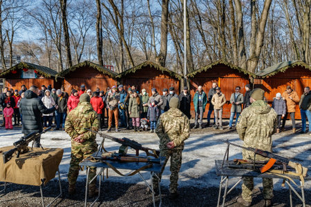 Uzhhorod, Ukraine - February 13, 2022: Military instructors instruct citizens before an open...